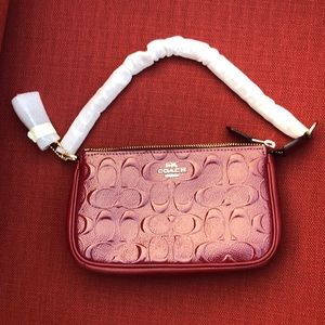NWOTCoach Signature Debossed In Cherry/Gold Patent